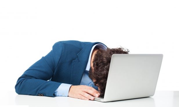 Man sleeping on laptop