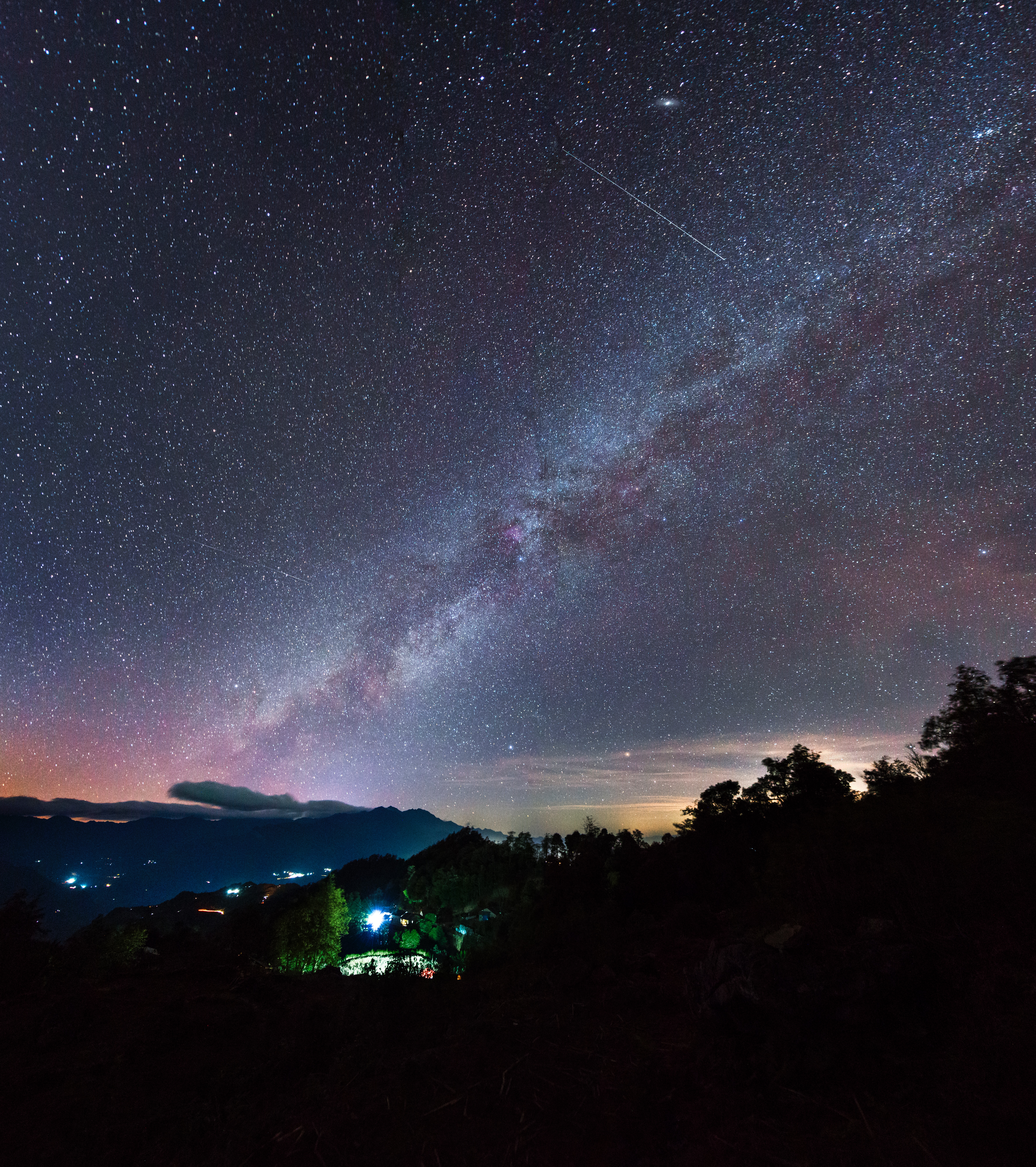 meteor streaking at starry night sky