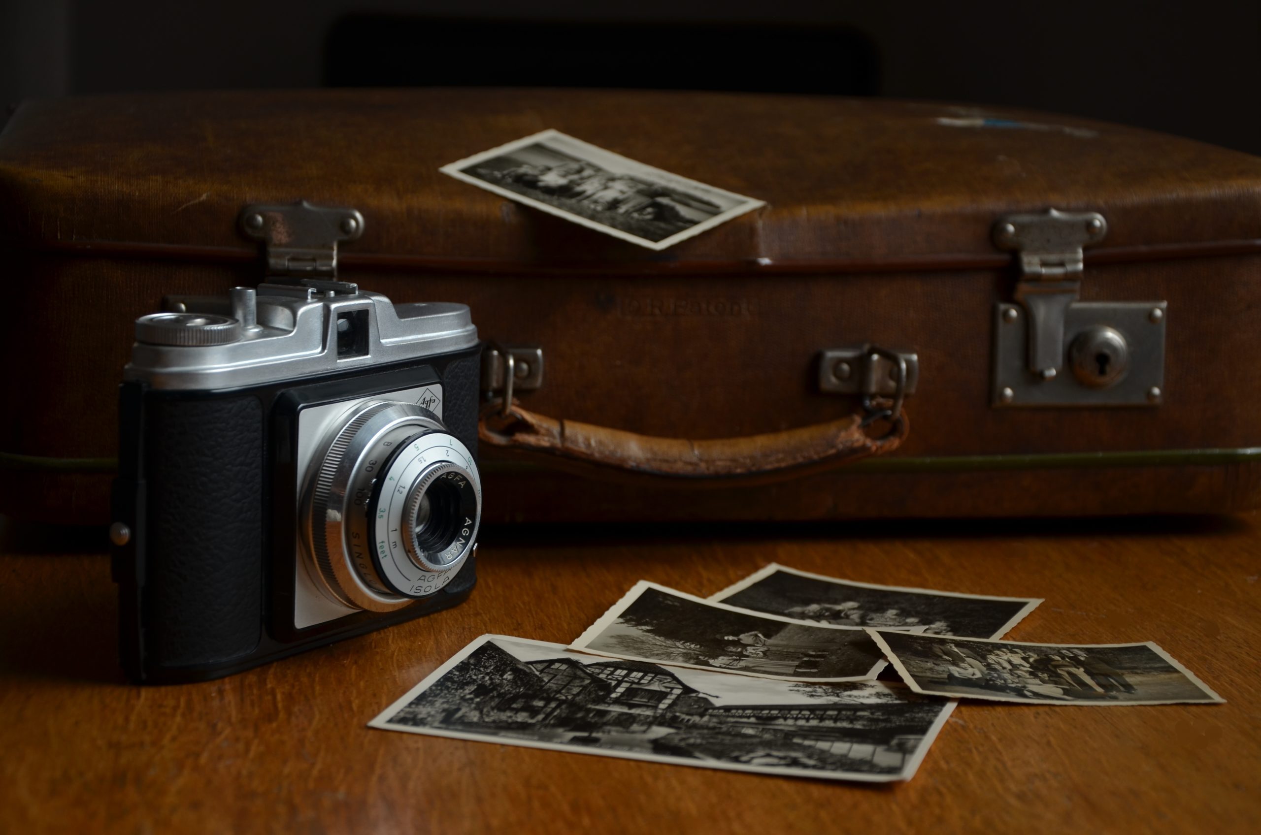 camera, luggage, polaroid photos