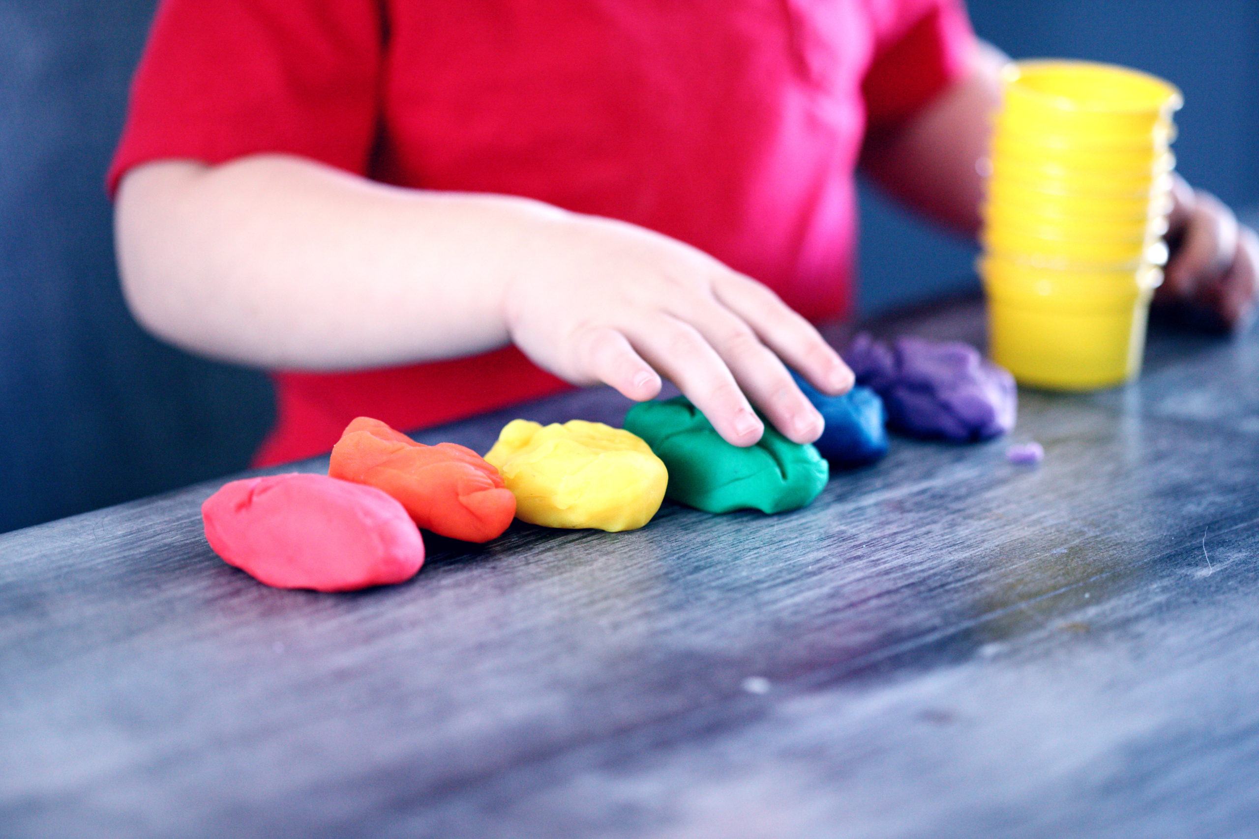 Person making clay figures